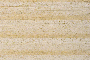 Beige background from sheets of chipboard. Wooden background from pressed sawdust.