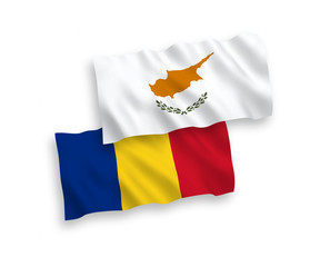 National vector fabric wave flags of Cyprus and Romania isolated on white background. 1 to 2 proportion.