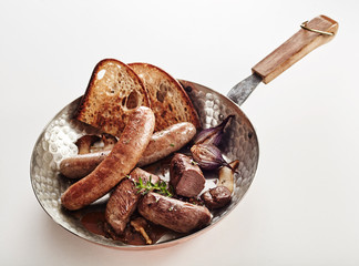 Assorted venison sausages with rye toast and herbs