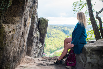 Naklejka premium Woman travelling to Rock Bridge Bastei and nature views - Saxon Switzerland, Germany 