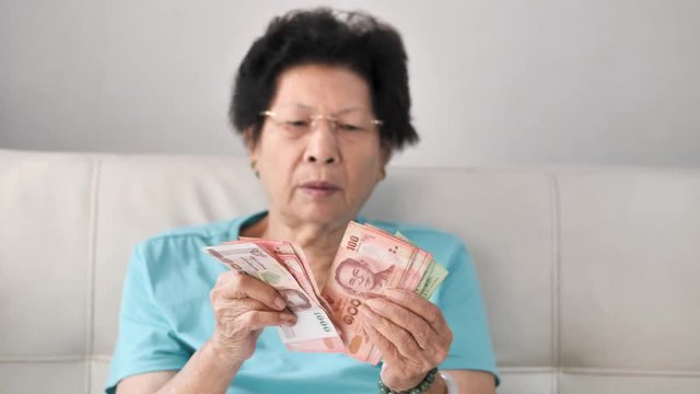 Senior woman receive subsistence allowance from government, lifestyle concept.