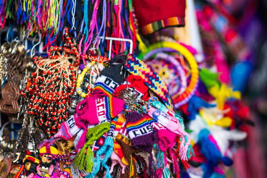 Colourful handcrafted souvenirs for sell at night market, Cusco, Peru