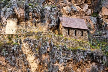 Stony house at rocky mountain in Ollantaytambo