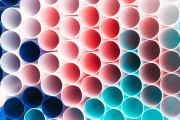 Abstract colorful background. Background from cocktail tubes close up. Soft focus. Cocktail tubes of different colors close up.Close-up of straw tubes.