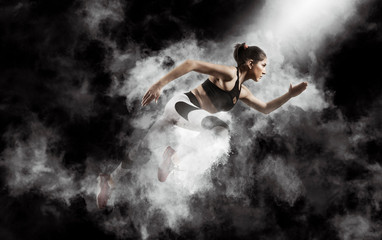 Fototapeta na wymiar Sporty young woman running