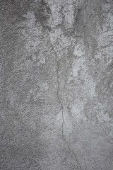 Cracked concrete wall gray colour