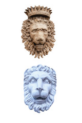 Plaster sculptures of lion heads isolated on white background