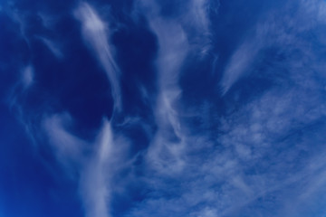 Beautiful blue sky with white cirrus clouds as a natural background