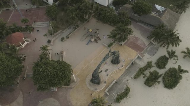Aerial footage of Playa del Carmen, Plaza fundadores, sculpture, holidays, Mexico