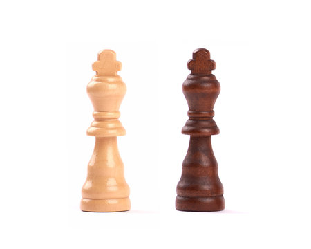 Detailed photo of two chess pieces, kings, black and white. Isolated on white background.