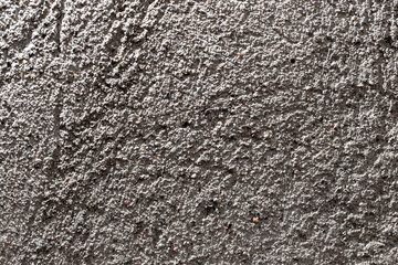 Wall of sand and concrete as an abstract background