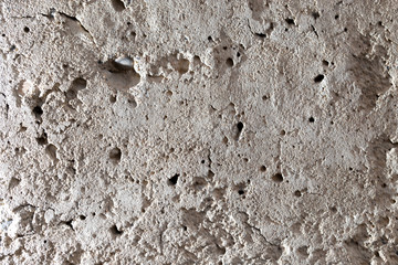 Wall of sand and concrete as an abstract background