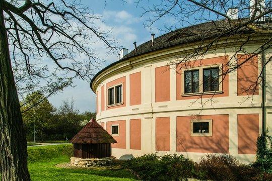 Prague, Czech Republic / Europe - April 05 2017: Chodov fortress, originally a round medieval fortress from 13th century. Sunny spring day in park with trees and green grass.