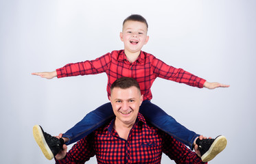 Happiness being father of boy. Having fun. Fathers day. Father example of noble human. Family time. Best friends. Father little son red shirts family look outfit. Child riding on dads shoulders