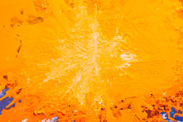 Creative abstract background. Textured splash design. Bright orange acrylic paint blob with marbled centerpiece effect.