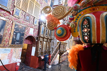 Security guard marvels at ornate decor of Santa Clara church (constructed in 1647), Bogota, Colombia