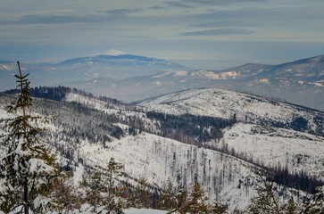 Fototapeta na wymiar Beautiful winter mountain landscape. Magical snow-covered slopes in the Polish mountains.