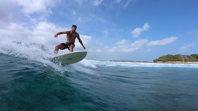 Surfer rides the ocean wave