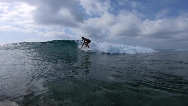 Surfer rides the ocean wave