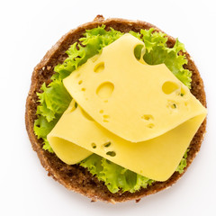 Sandwich with lettuce, cheese on white background.