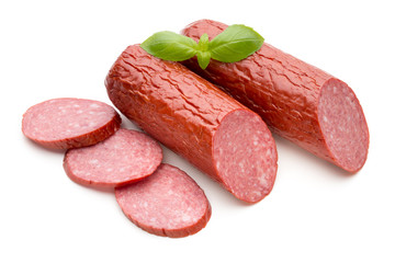 Salami smoked sausage, basil leaves on white background cutout.