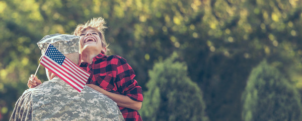 Happy reunion of soldier with family outdoors