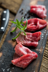 Thinly sliced beef pieces. beef carpaccio