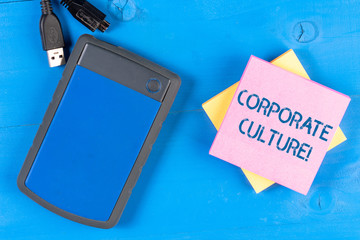 Writing note showing Corporate Culture. Business concept for beliefs and attitudes that...