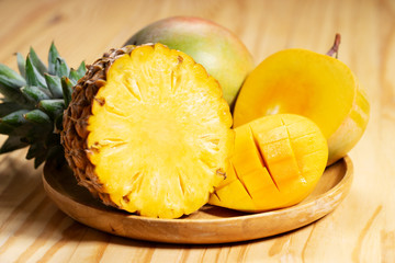 fresh pineapple and mangoes