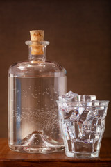Glass of ice cold water and a bottle