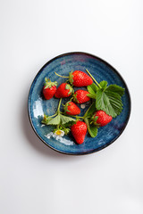 Organic berry on plate, food top