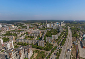 Fototapeta na wymiar Top down aerial drone image of a Ekaterinburg city in the end of spring, backyard turf grass and trees lush green
