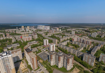 Top down aerial drone image of a Ekaterinburg city in the end of spring, backyard turf grass and trees lush green