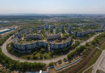 Obraz premium Top down aerial drone image of a Ekaterinburg city in the end of spring, backyard turf grass and trees lush green