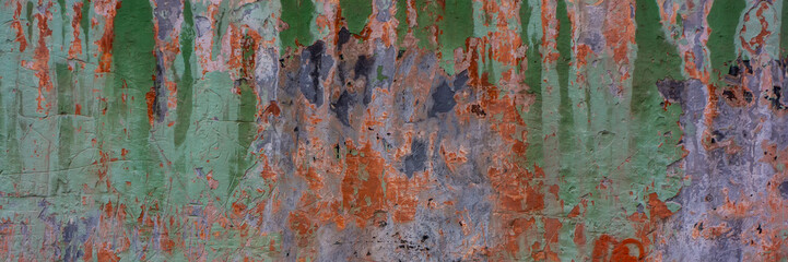 wall covered with old collapsing cement colored plaster.