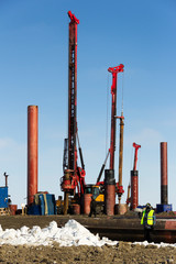 Drilling equipment build the sea port of Sabetta. Yamal, Russia. Winter, sunny