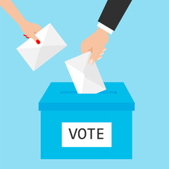 Voting concept. Hands putting paper in the ballot box