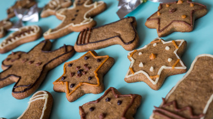 Closeup Christmas Gingerbread cookies on the blue table. Crhistmas celebration.