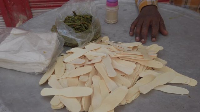 Close-up of Mathri Aloo, classic savory Indian snack or crackers. A flaky biscuit made from flour, water, and cumin seeds served with potato masala curry. slow motion Handheld stabilized gimbal 4k