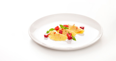 Pineapple dessert with cream cheese and raspberry on the white background. Fresh and healthy summer dessert