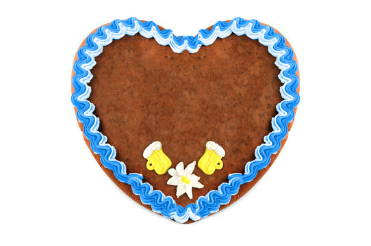 Oktoberfest Gingerbread heart cookie with ornaments and copy space