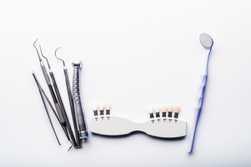 Dental equipment on white table with copy space