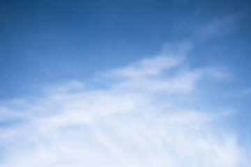 blurred image of blue sky in the cloudy day