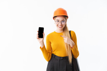 Attractive young woman architect standing isolated