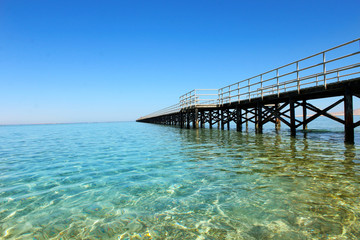 Fototapeta premium Panoramic image of the bridge in the sea