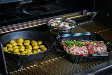 delicious lamb chops with bone grilled under flames with roasted vegetables