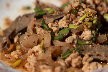 Spicy minced pork salad or Ground pork salad thai food.