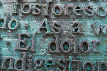 Metal letters and words in spanish and english. Text background.