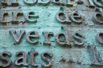 Metal letters and words in spanish and english. Text background vintage.