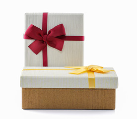 red and gold gift box with ribbon and bow isolated on white